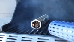 Big Boy The Smoke Pipe - 12" Stainless Steel Wood Chip And Pellet Smoking Tube -BBQ Equipment The Smoking Pipe Big Boy Pellet and Wood Smoking Box Tube wood chips being lit by looft lighter